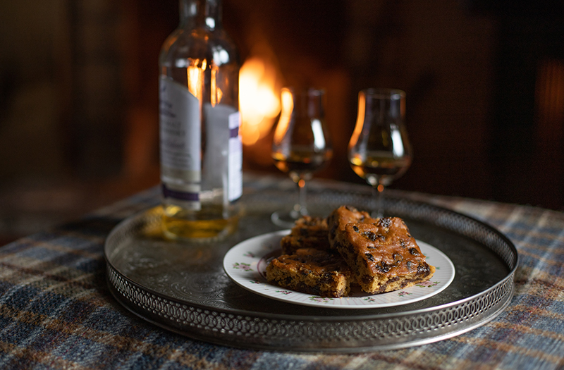 Lazy day foods fruit cake by the fire with whisky
