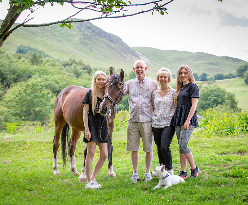 Family portrait with horses and dogs  near Edinburgh